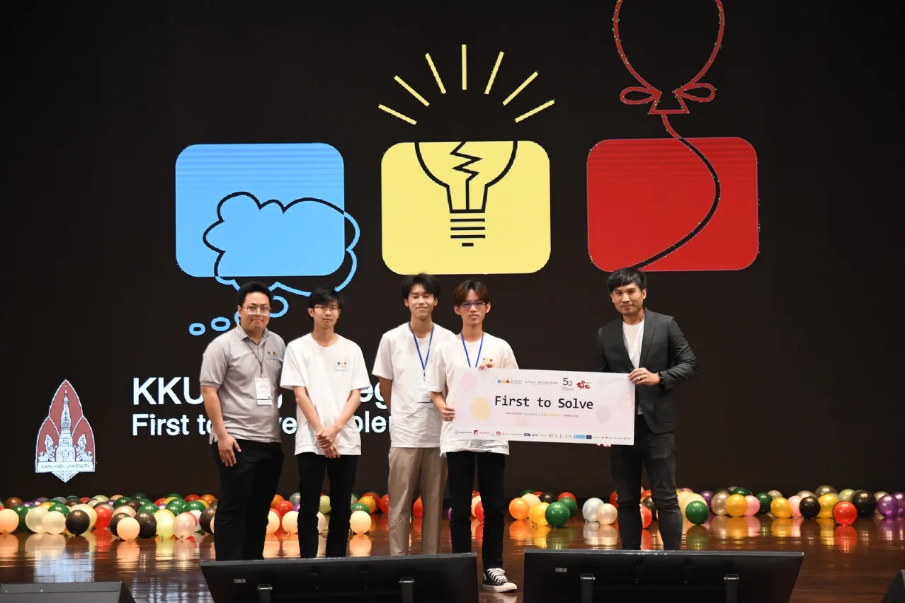 Team Eeg E Eeg Eeg on stage holding the First to Solve board at ICPC Thailand 2024