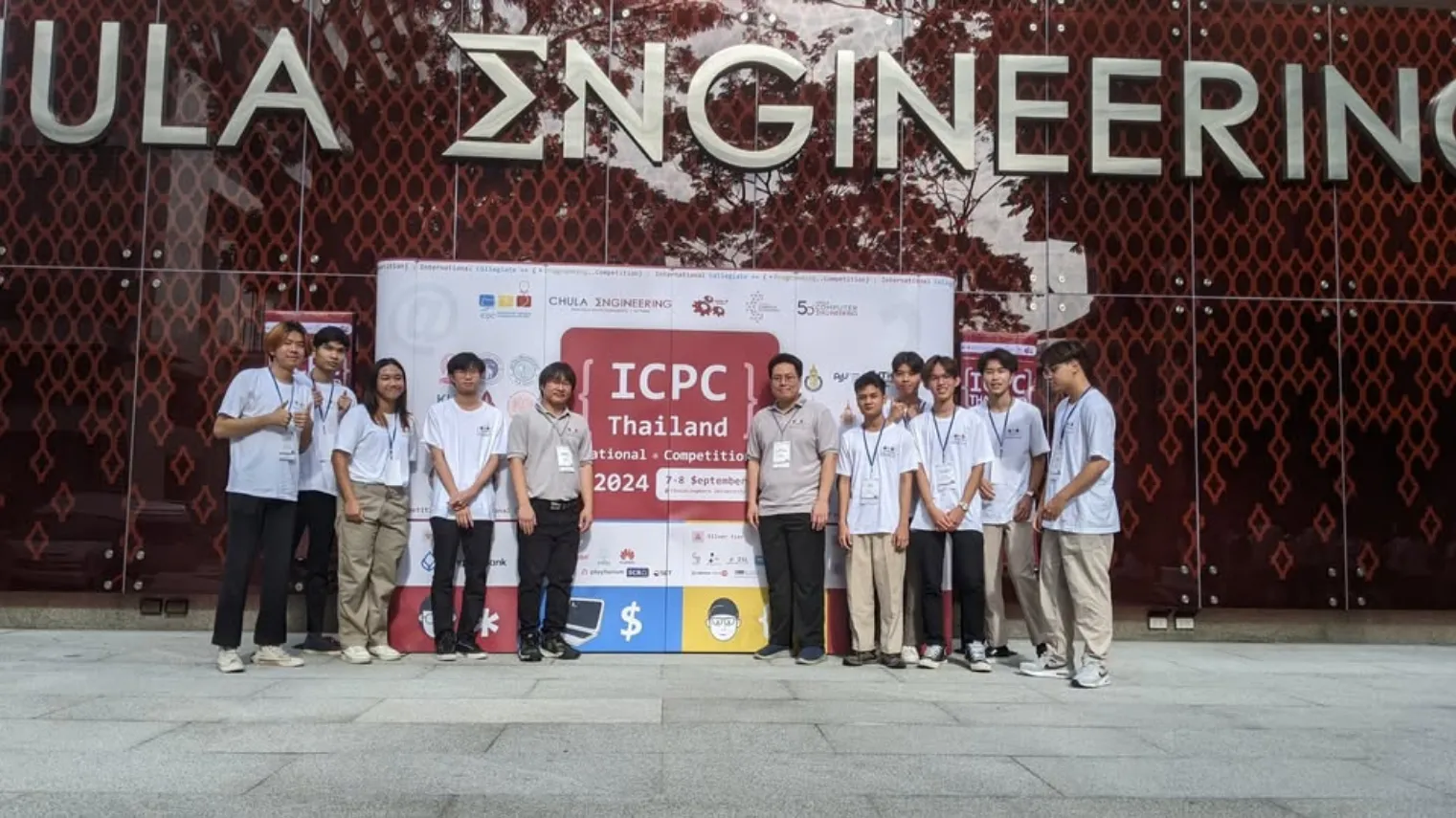 Contestants in front of the ICPC Thailand 2024 banner at Chula Engineering
